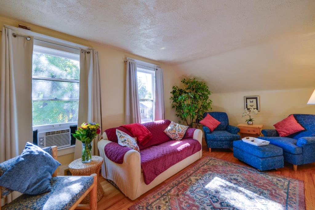 a living room with a couch and two chairs and a window at Cozy Billings Apartment about 1 Mi to Downtown! in Billings