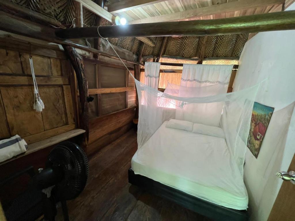 Postel nebo postele na pokoji v ubytování Sierra Tayrona hostel