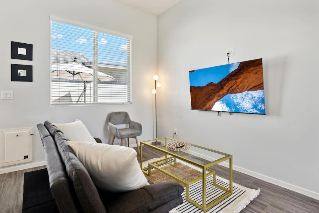a living room with a couch and a glass table at Dreamlight Modern Home in Casa Grande with Pool,BBQ in Casa Grande