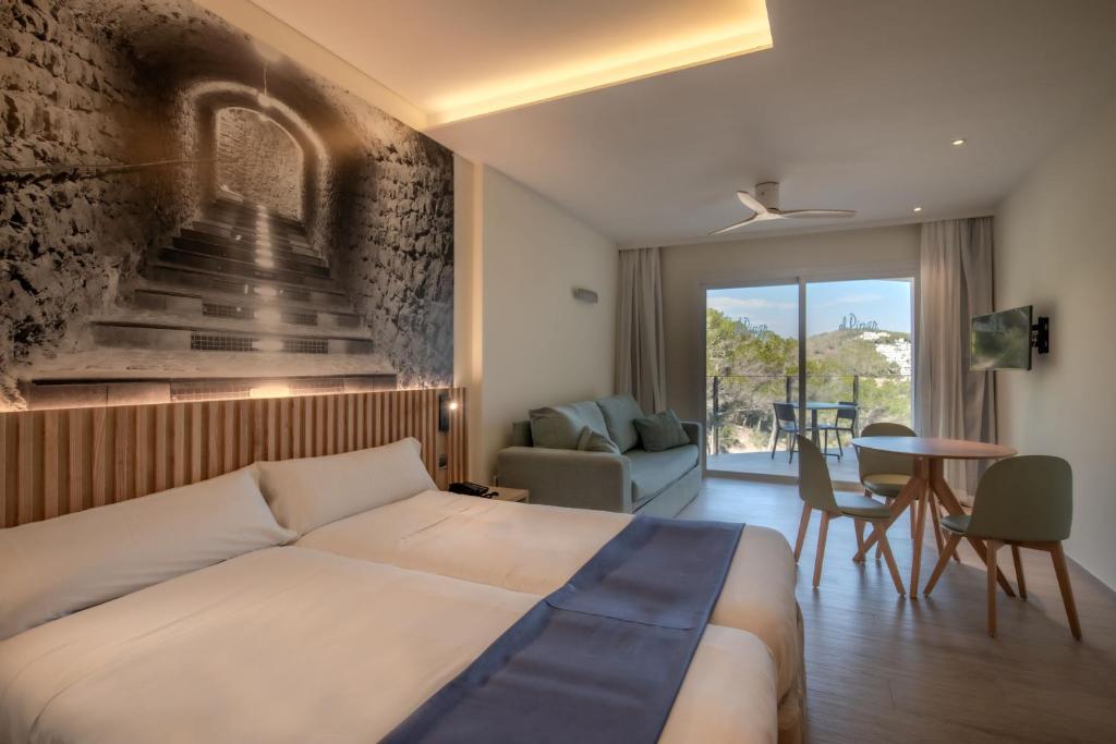Posteľ alebo postele v izbe v ubytovaní Hotel El Pinar