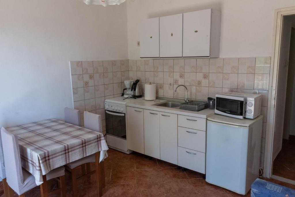 Kuchnia lub aneks kuchenny w obiekcie Apartments by the sea Zadar - Diklo, Zadar - 5925