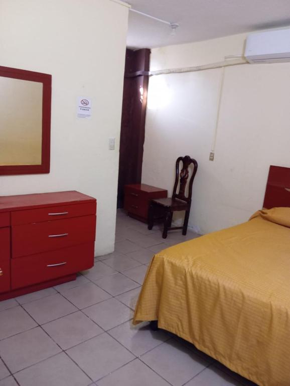 Postel nebo postele na pokoji v ubytování Hotel Juarez