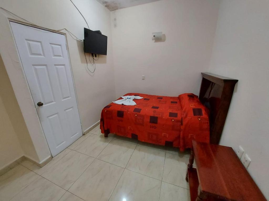 Postel nebo postele na pokoji v ubytování Hotel Juarez