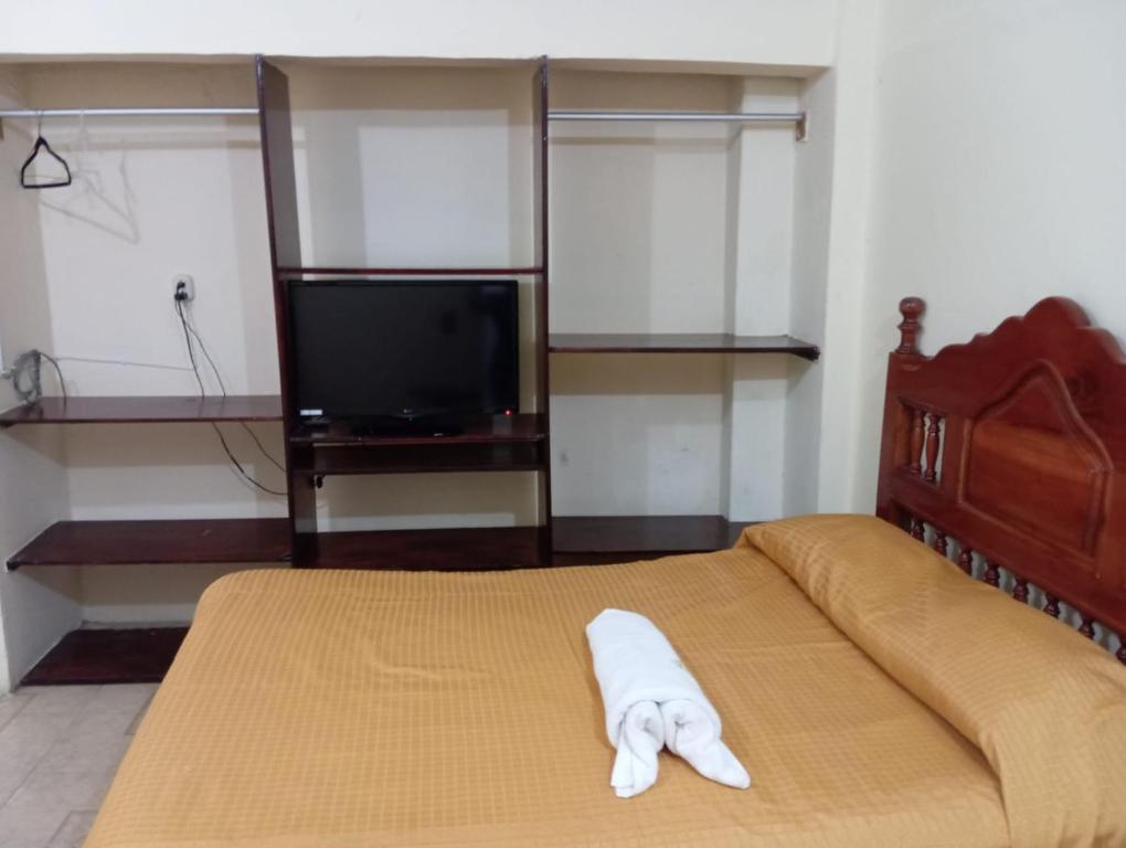 Postel nebo postele na pokoji v ubytování Hotel Juarez