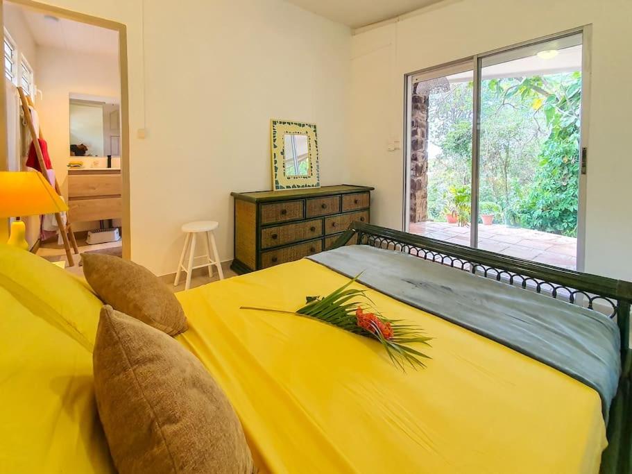 Postel nebo postele na pokoji v ubytování Villa Goyave
