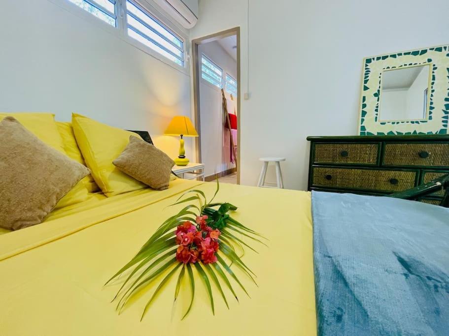 Postel nebo postele na pokoji v ubytování Villa Goyave