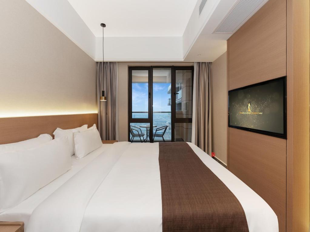 Postel nebo postele na pokoji v ubytování JD POLMAN Hotel