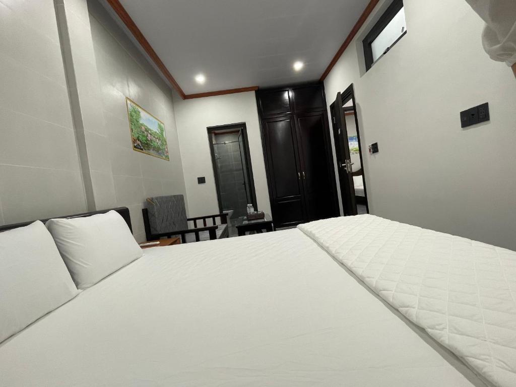 Postel nebo postele na pokoji v ubytování Hung Thinh Motel