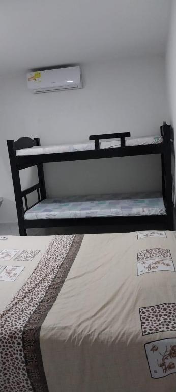 Postel nebo postele na pokoji v ubytování LA MEDELLIN HOSTAL