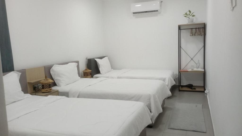 Postel nebo postele na pokoji v ubytování Three Homestay
