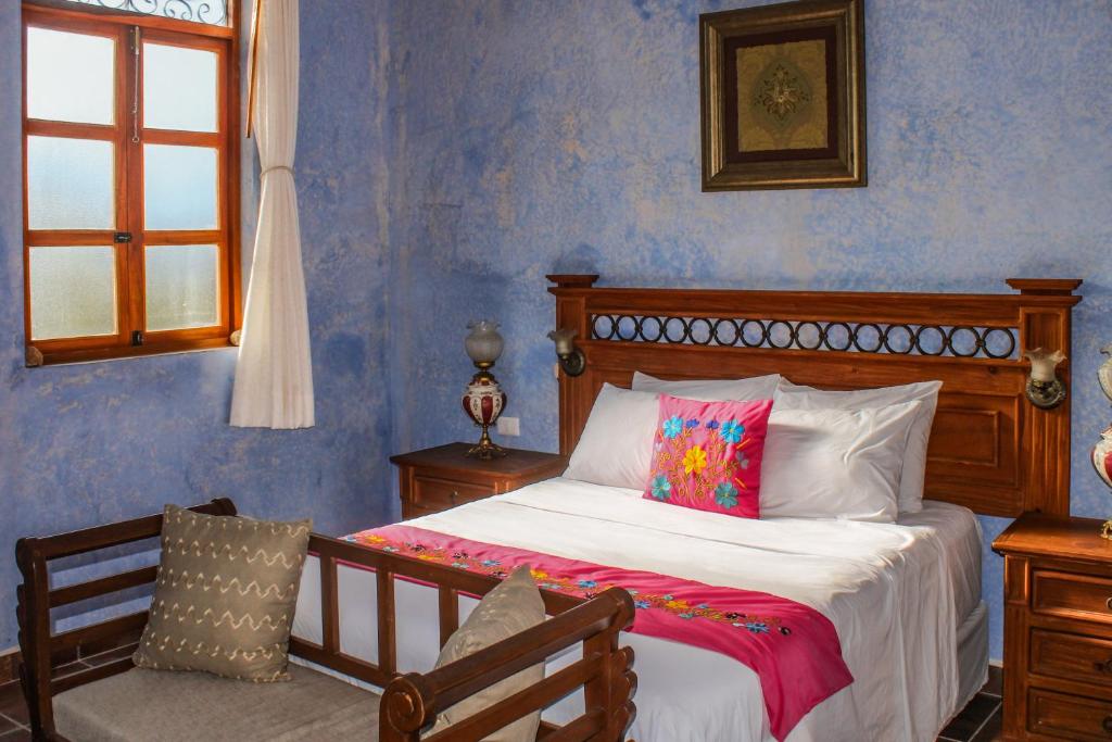Postel nebo postele na pokoji v ubytování Casa Vicenta Izamal