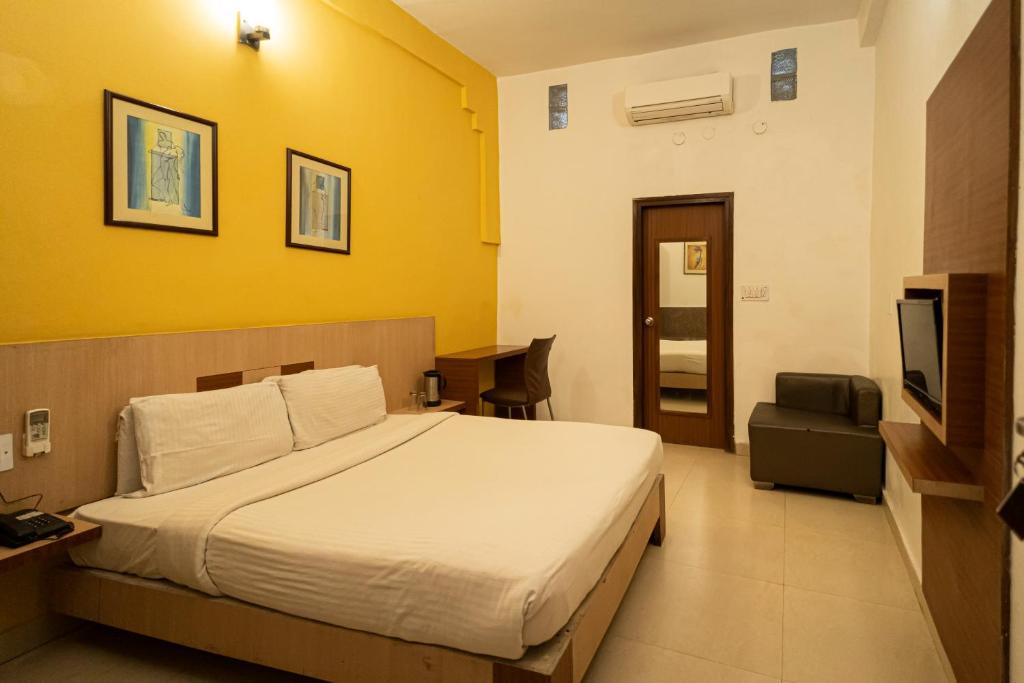 Postel nebo postele na pokoji v ubytování Sparrow Hotel Managed by Siara Sariska Alwar
