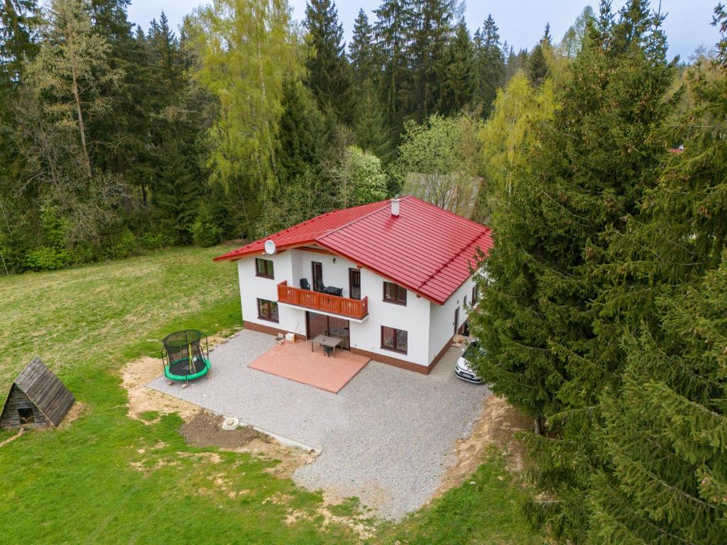 an aerial view of a house with a red roof at White Hawk - Vila Sokolík in Lazisko