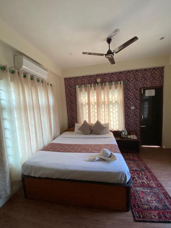 Кровать или кровати в номере Hotel Safari Suite