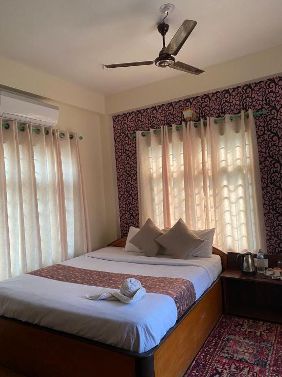 Кровать или кровати в номере Hotel Safari Suite