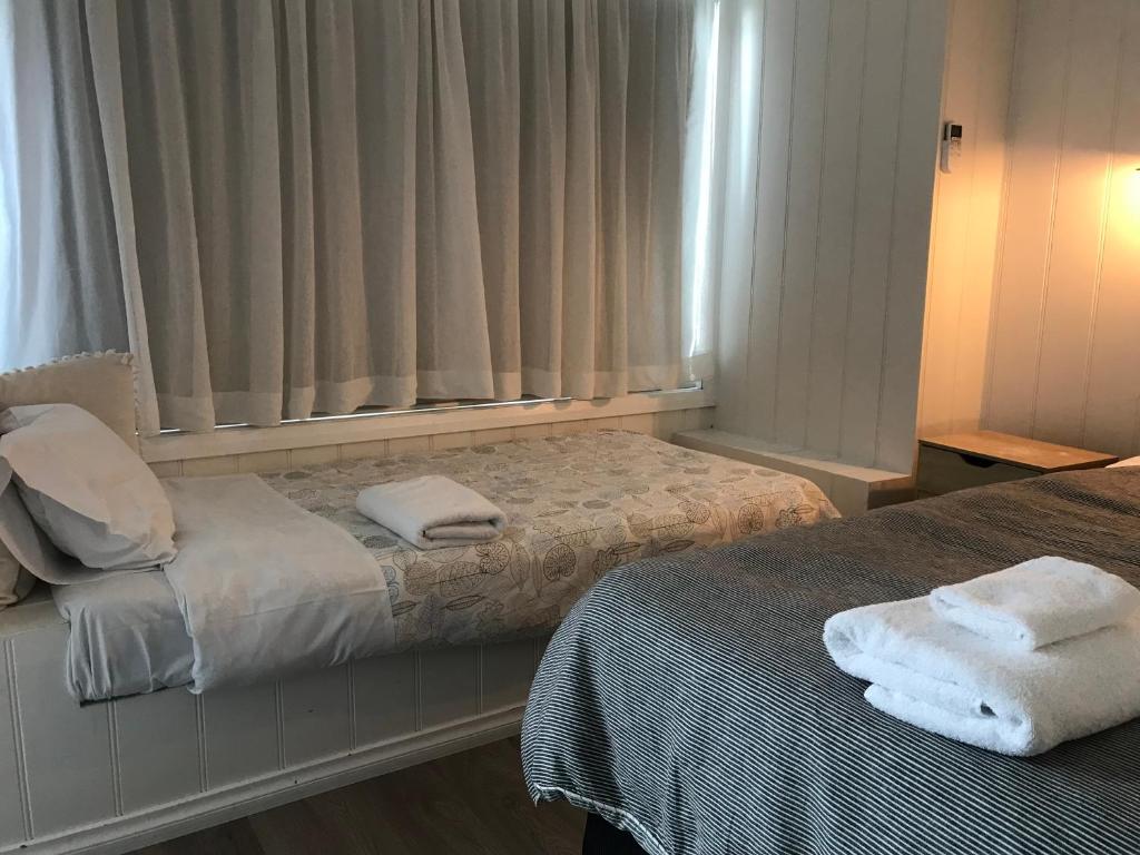 Postel nebo postele na pokoji v ubytování Beachend Bicheno