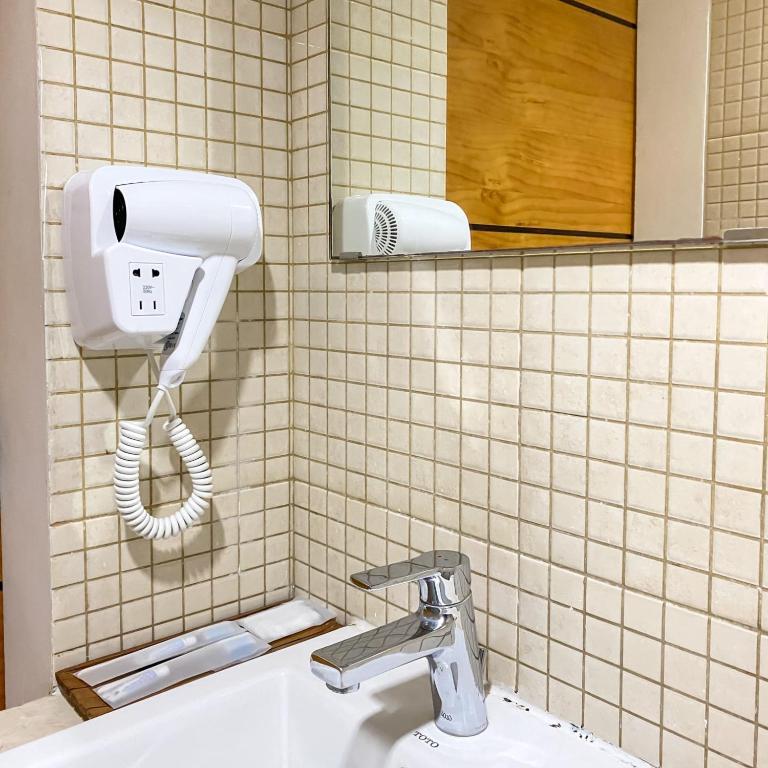 Koupelna v ubytování M Hotel