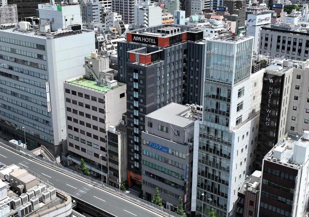 an aerial view of a city with tall buildings at APA Hotel Ueno Ekimae in Tokyo