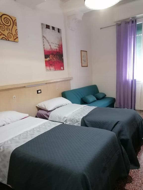 Postel nebo postele na pokoji v ubytování Acquamarina