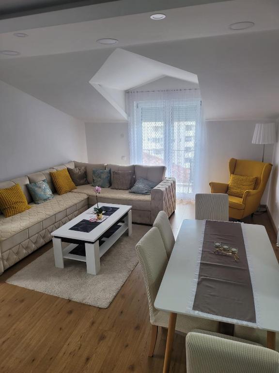 a living room with a couch and a table at Apartman Sonja Trebinje in Trebinje