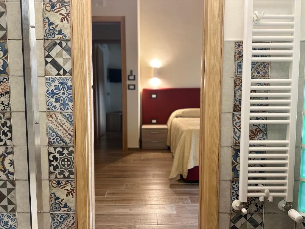 Postel nebo postele na pokoji v ubytování LorichiAmo B&b