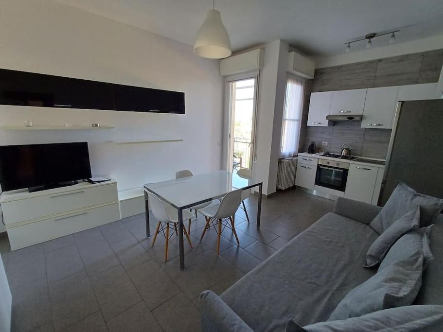 a living room with a couch and a table at Appartamento vista mare Misano Adriatico in Misano Adriatico