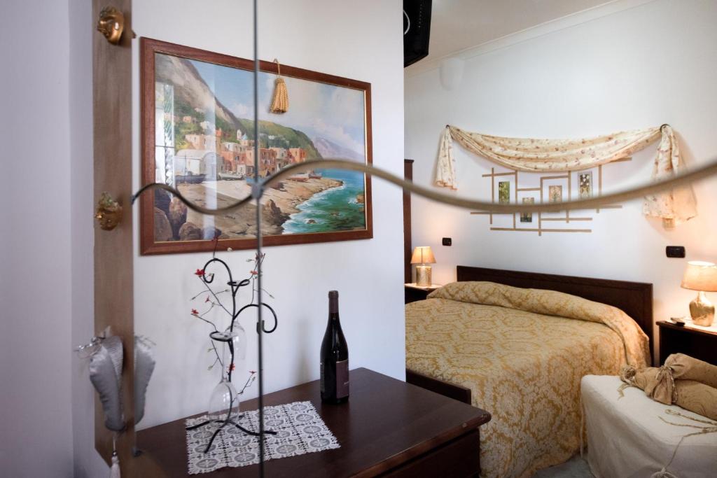 A bed or beds in a room at H.H.Le Palme