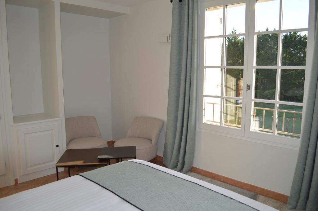 Postel nebo postele na pokoji v ubytování Le Domaine d'Euphony