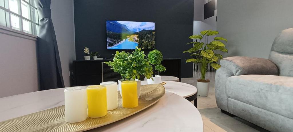 Μια τηλεόραση ή/και κέντρο ψυχαγωγίας στο Ipoh Garden East Homestay by Grab A Stay