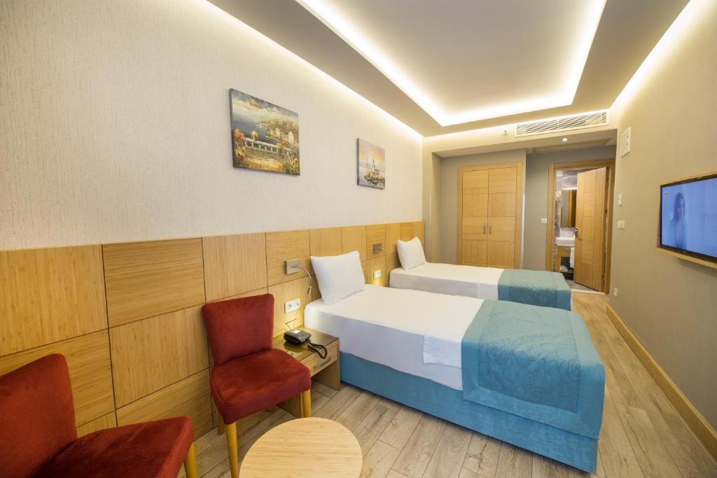 Postel nebo postele na pokoji v ubytování Meretto Hotel LALELİ