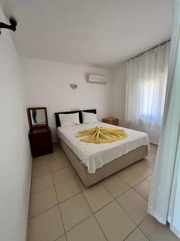 Ein Bett oder Betten in einem Zimmer der Unterkunft Adrasan Parlak evleri