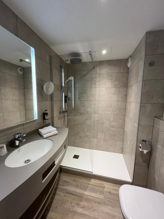 Koupelna v ubytování Hôtel Le Ménestrel