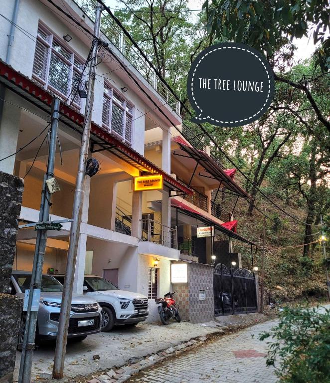 a house with a car parked in front of it at The Tree Lounge in Bhīm Tāl