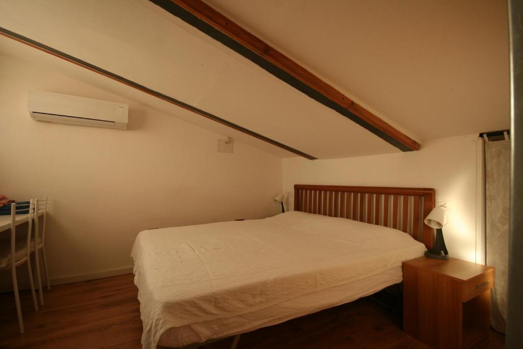 En eller flere senge i et værelse på Da Giulia