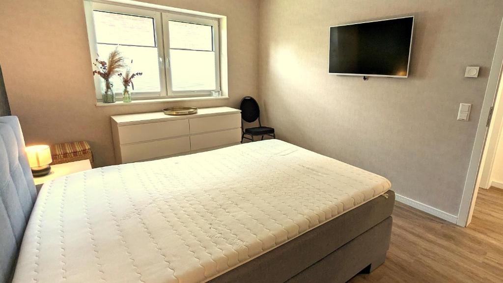 TV a/nebo společenská místnost v ubytování Ferienhaus-Annelore