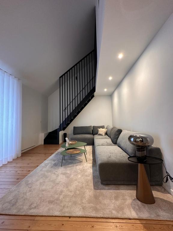 a living room with a couch and a table at Charmant duplex au Pouliguen in Le Pouliguen