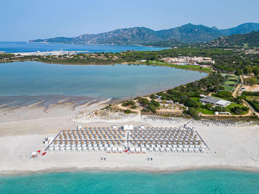 an aerial view of a beach with a resort at Almar Timi Ama Resort & Spa in Villasimius