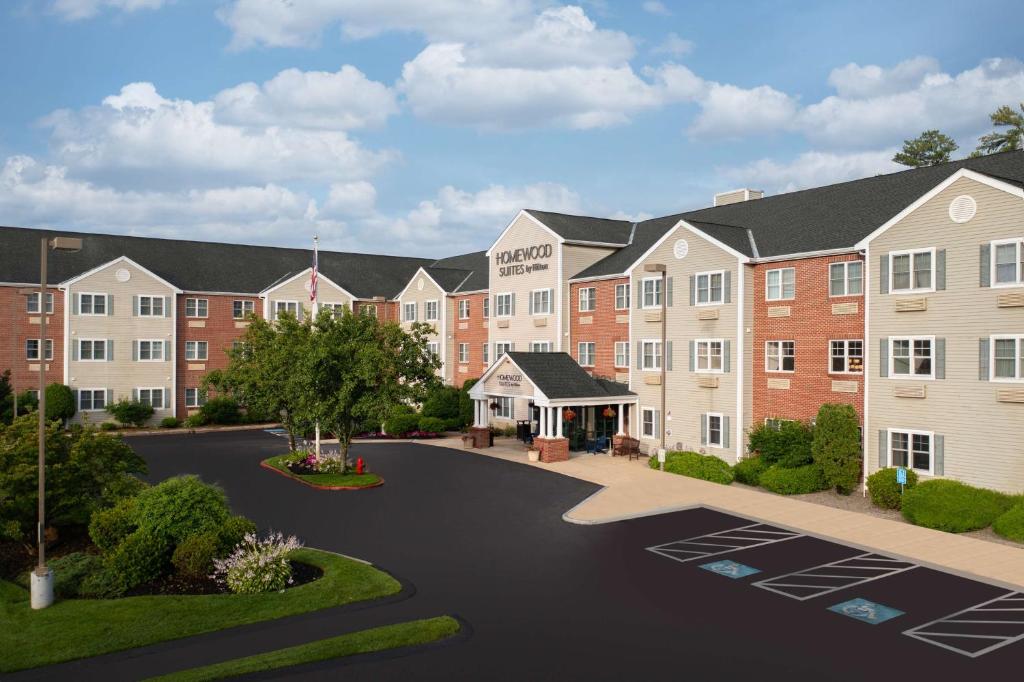 a rendering of an apartment complex with a parking lot at Homewood Suites by Hilton Boston/Andover in Andover