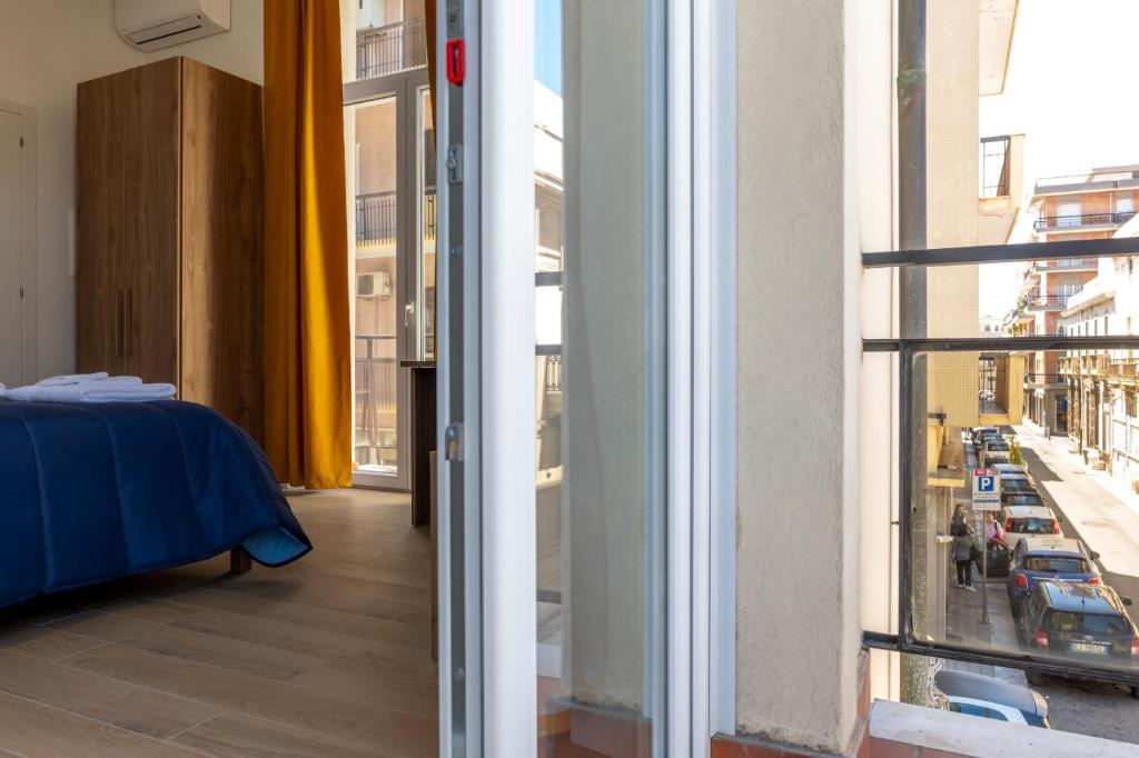 Postel nebo postele na pokoji v ubytování Palazzo Quattrone