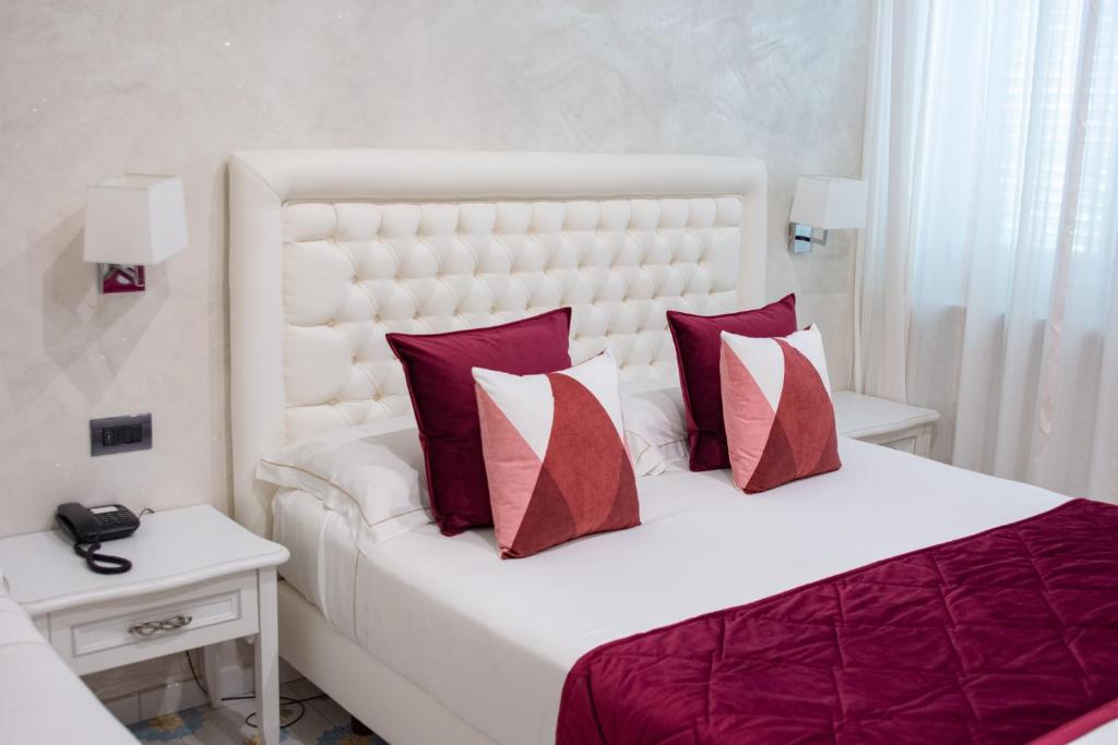 Postel nebo postele na pokoji v ubytování Hotel San Pietro