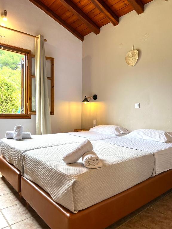 Postel nebo postele na pokoji v ubytování Panos Villas
