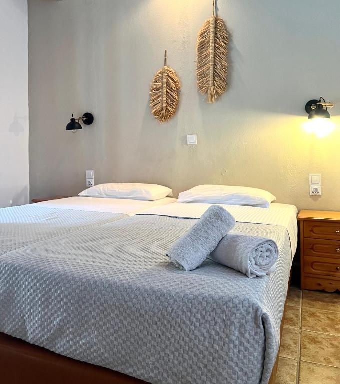 Postel nebo postele na pokoji v ubytování Panos Villas