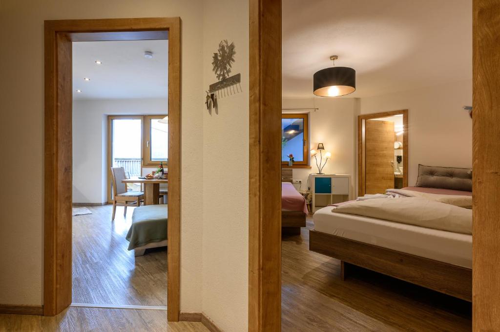 Postel nebo postele na pokoji v ubytování Restaurant Appartements Almdiele