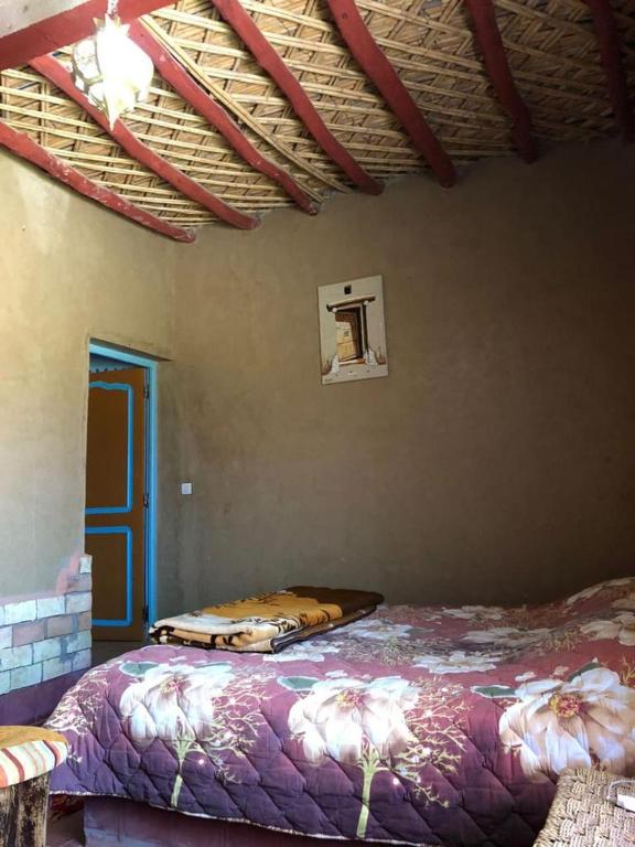 Postel nebo postele na pokoji v ubytování GITE LA GROTTE VALLEE
