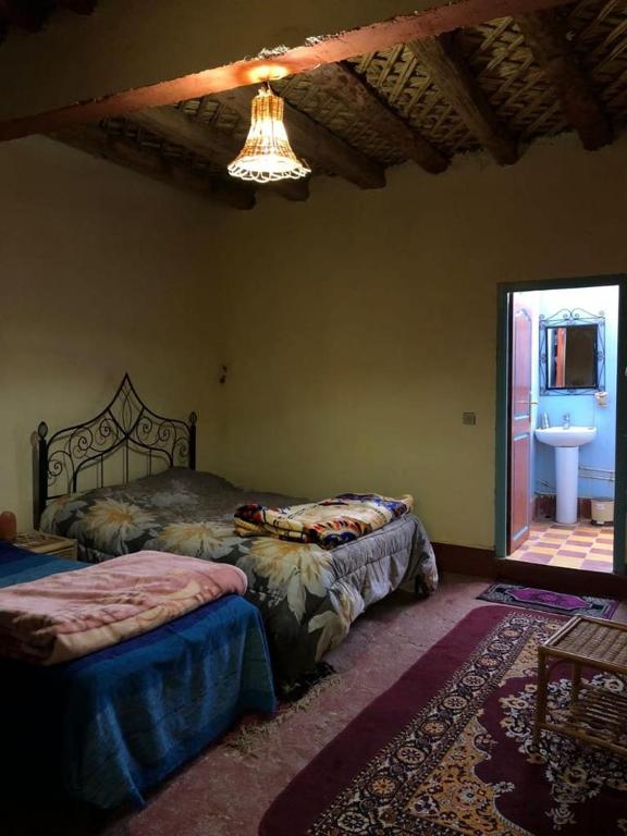 Postel nebo postele na pokoji v ubytování GITE LA GROTTE VALLEE