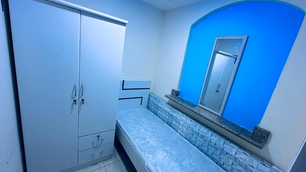 a bathroom with a mirror and a sink at Dar Al Mansoor Vacation Homes LLC in Dubai