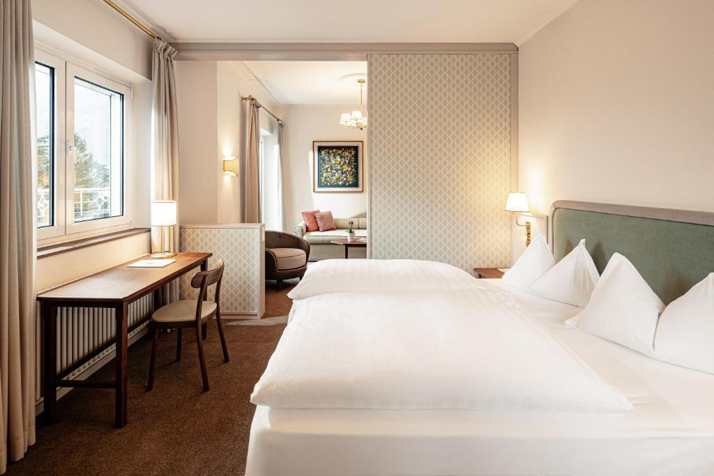 Postel nebo postele na pokoji v ubytování Classic Hotel Meranerhof