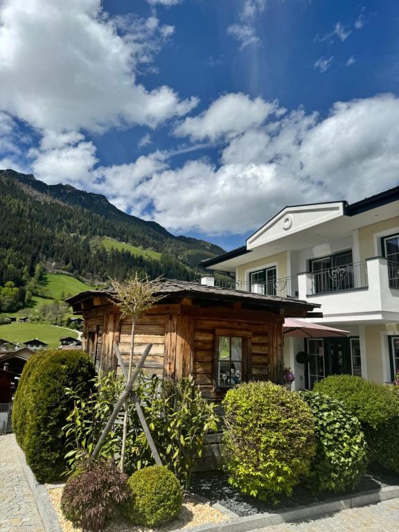 a log home with a view of the mountains at Haus Ilmer in Neustift im Stubaital
