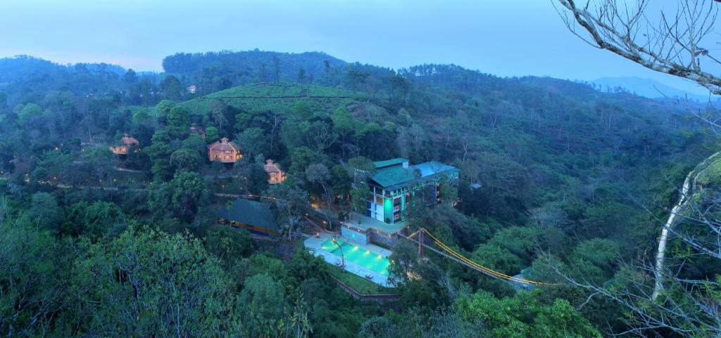 an aerial view of a house in the middle of a forest at Vythiri Village in Vythiri