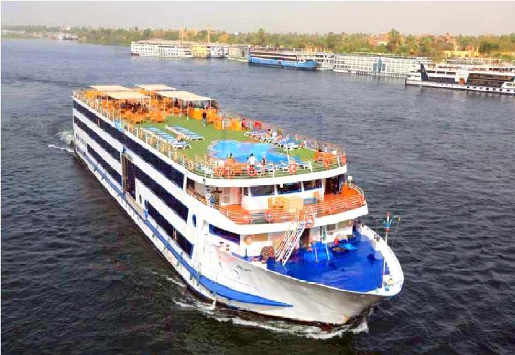 a large cruise ship in the water at live Nile in style Nile cruise in Luxor and Aswan in Luxor